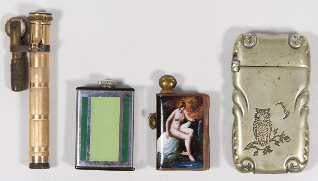 Cigarette / Cigar Lighter Assortment: Cigarette / Cigar Lighter Assortment Four items including a 'G. SILVER' marked lighter case with an owl motif, a guilloche enamel lighter with a nude female image and an 'EH' mark, a gold filled light