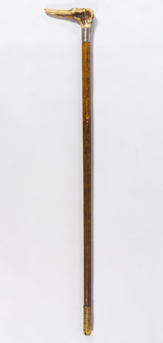 Carved Dog Head Cane: Carved Dog Head Cane Having a carved dog head with glass eyes, a monogrammed metal collar and a wood shaft Length: 24.50 inches Category: Clothing & Accessories > Canes Shipping Status: Due to size, w