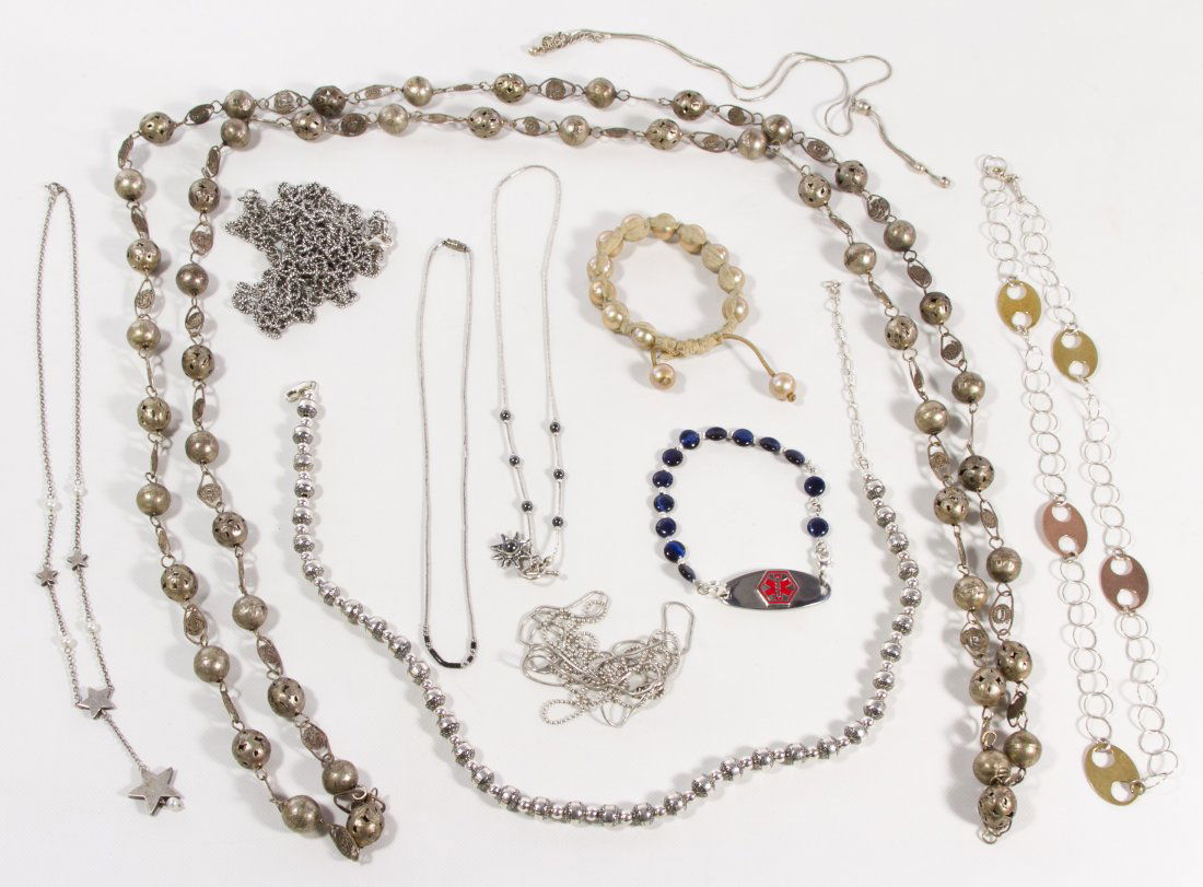 Sterling Silver Beaded Necklace Assortment: Sterling Silver Beaded Necklace Assortment Nine necklaces; together with two beaded bracelets Length: 64.00 inches (longest) Weight: 161.91 dwts. (without one bracelet) Category: Jewelry and Timepiece