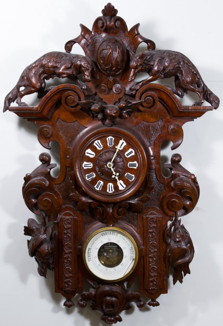 Black Forest Carved Wall Clock and Barometer: Black Forest Carved Wall Clock and Barometer Late 19th Century, depicting a fish, a fox, a bird and a hunting dog; carved initials 'CM' at the top; including pendulum Height: 39.50 inches, Width: 27.0