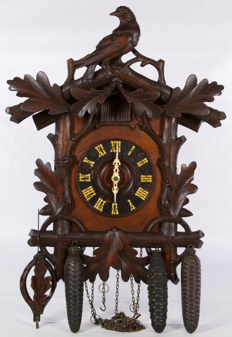 West German Cuckoo Clock: West German Cuckoo Clock Having two cuckoo birds, carved bird crest, a 'West Germany' mark on the bellows and a 'Sears, Roebuck & Co. Germany' back plate mark; including three weights and a pendulum H