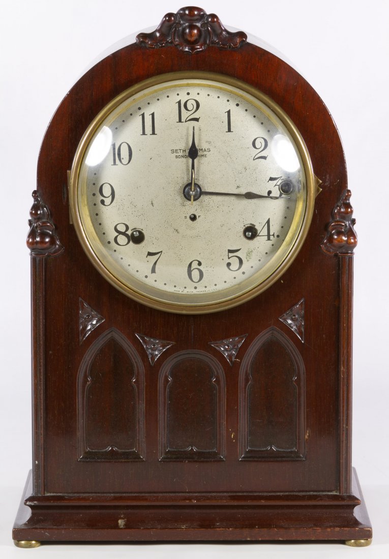 Sonora Chime Bracket Clock by Seth Thomas: Sonora Chime Bracket Clock by Seth Thomas Having a cherry stained Gothic style case, metal face and brass bezel; including pendulum Height: 15.50 inches, Width: 10.00 inches, Depth: 7.00 inches Catego
