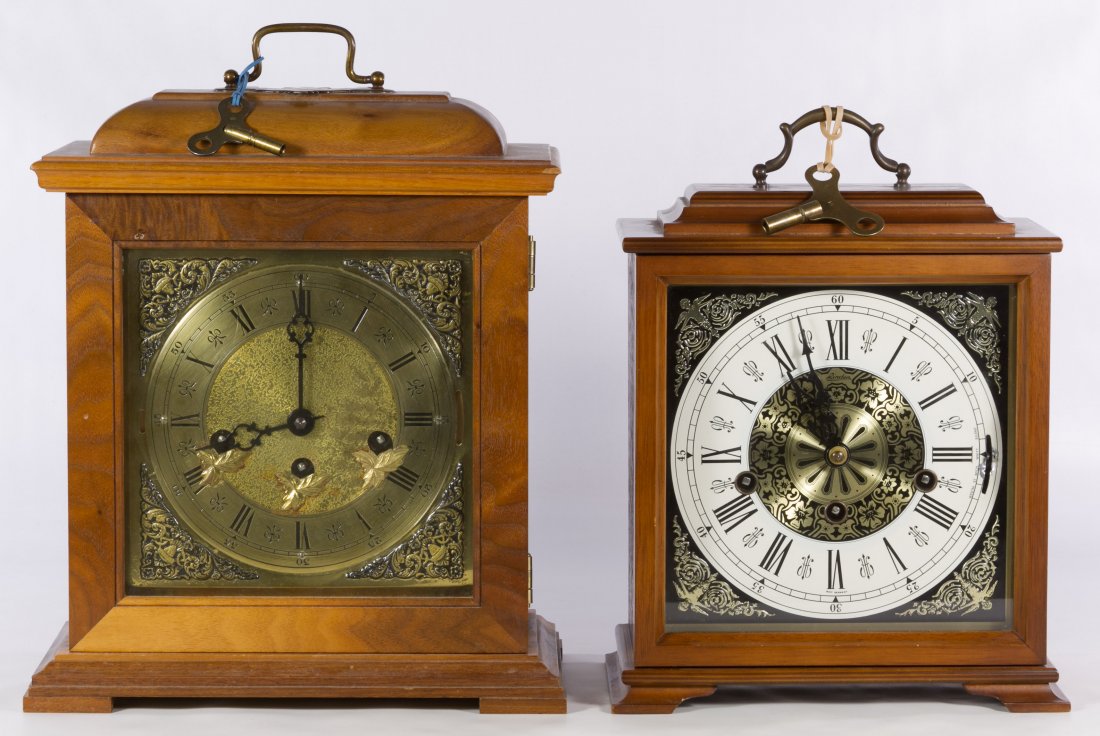 Western Germany Mantel Clocks: Western Germany Mantel Clocks Two items including a walnut clock with raised leaf brass face and a back plate mark 'Franz Hermle' and a with a 'Linden' marked face clock with back plate mark 'Cuckoo C