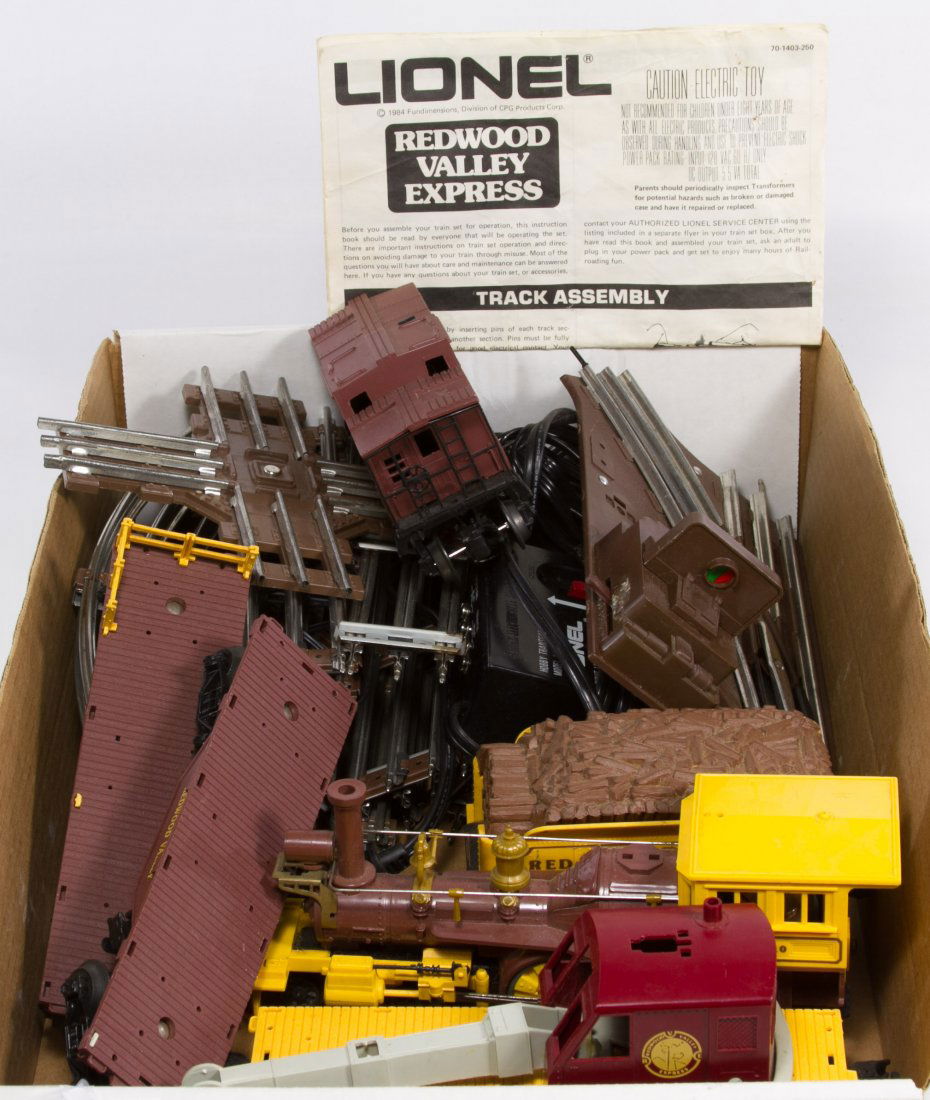 Lionel Train Set 'Redwood Valley Express' #6410: Lionel Train Set 'Redwood Valley Express' #6410 c.1984 set including an engine, tender, crane, two flat bed cars, a caboose, track and transformer Length: 8.75 inches (engine) Category: Toys and Dolls