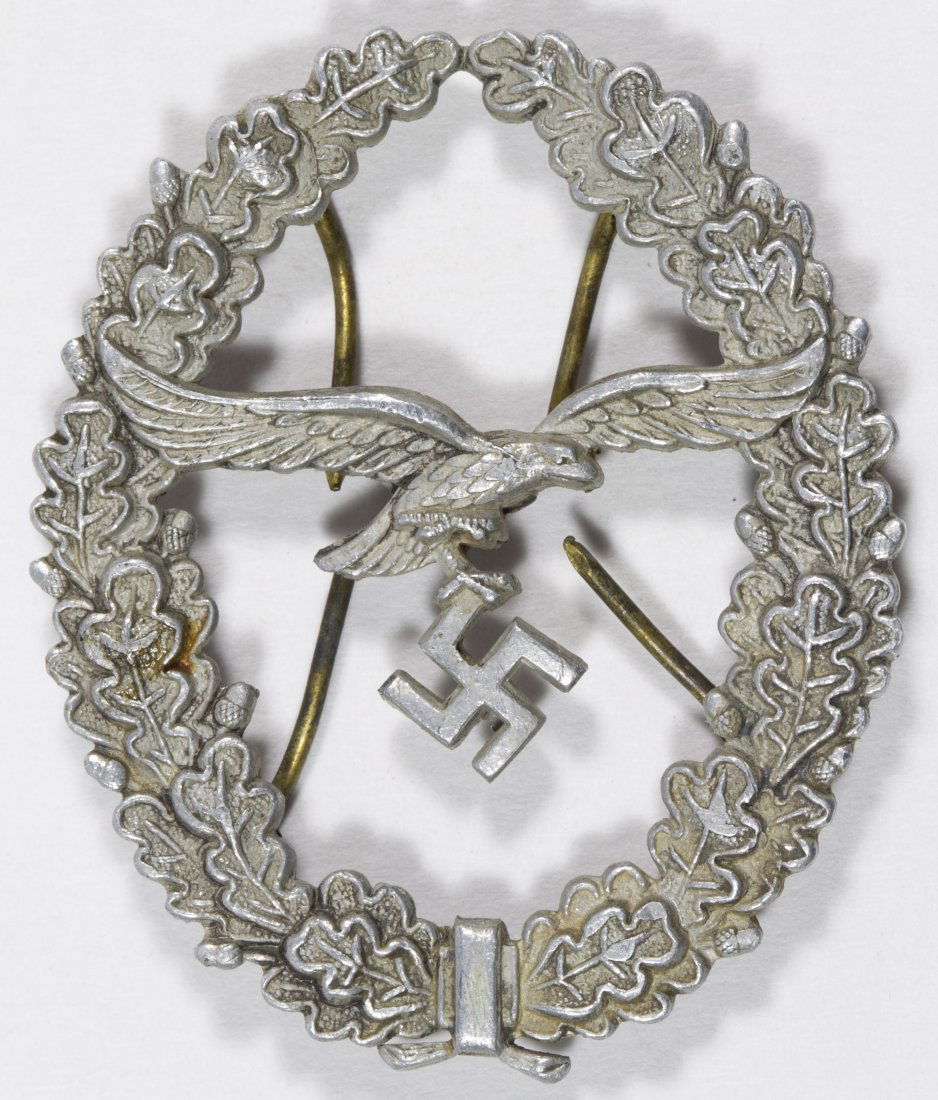 World War II German Luftwaffe Badge: World War II German Luftwaffe Badge Having a flat back; possibly for hat or uniform Height: 2.00 inches, Width: 1.50 inches Category: Military & Weapons > World War II Shipping Status: Leonard Auction