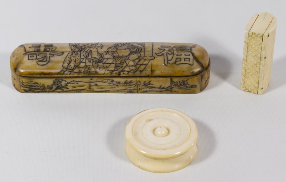 Asian Bone Boxes: Asian Bone Boxes Three items including a hinged rectangular box, a round box with lid and an oblong bone or antler box with etched symbols and a nude female Length: 5.75 inches (longest) Category: Dec