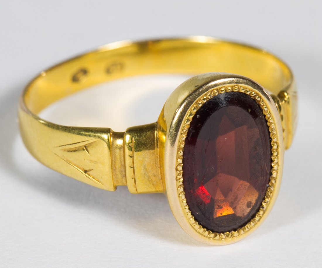 14k Gold and Garnet Ring: 14k Gold and Garnet Ring Having an oval flat cut garnet Size: 8 Weight: 2.31 dwts. (total weight) Category: Jewelry and Timepieces > 14k Gold Shipping Status: Leonard Auction, Inc. will directly ship 