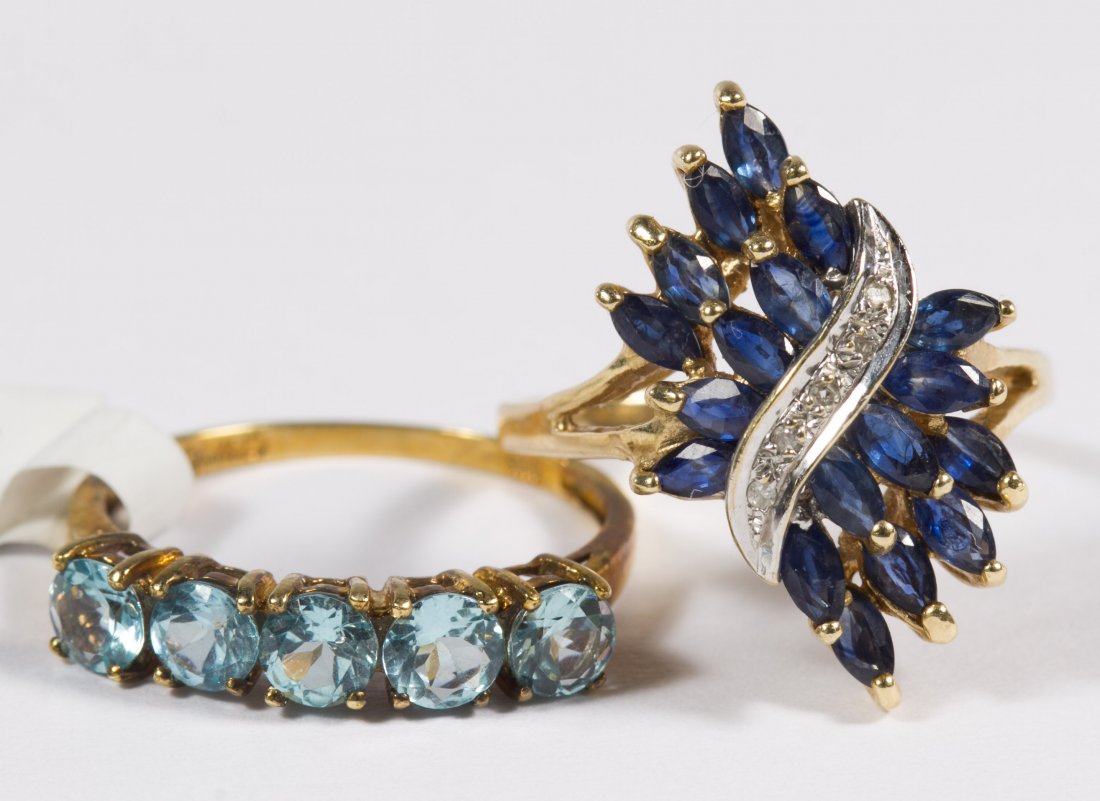 10k Gold, Blue Apatite, Sapphire and Diamond Rings: 10k Gold, Blue Apatite, Sapphire and Diamond Rings Two rings including one having five round cut blue apatites and the other having marquis cut sapphires with a band round cut diamonds through the mid