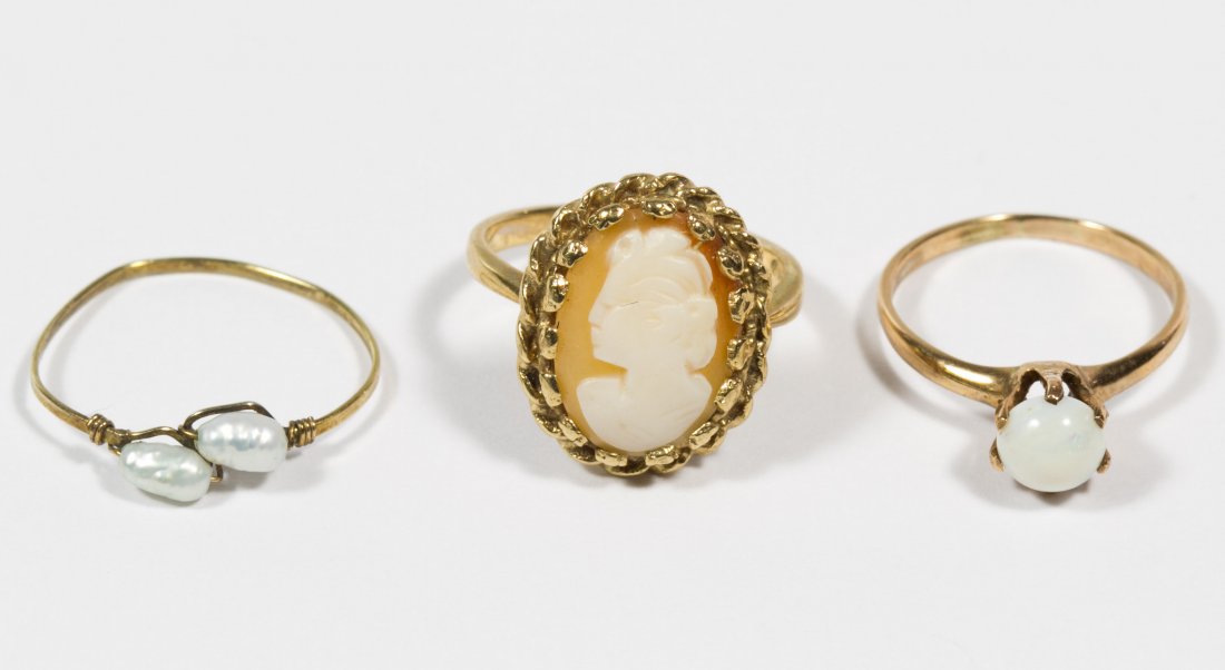 10k Gold, Cameo, Pearl and Opal Rings: 10k Gold, Cameo, Pearl and Opal Rings Three rings all set with stones including carved shell cameo having a female profile, fresh water pearls and a round cut cabochon opal Size: 4.75, 5.25 & 6.5 Weig