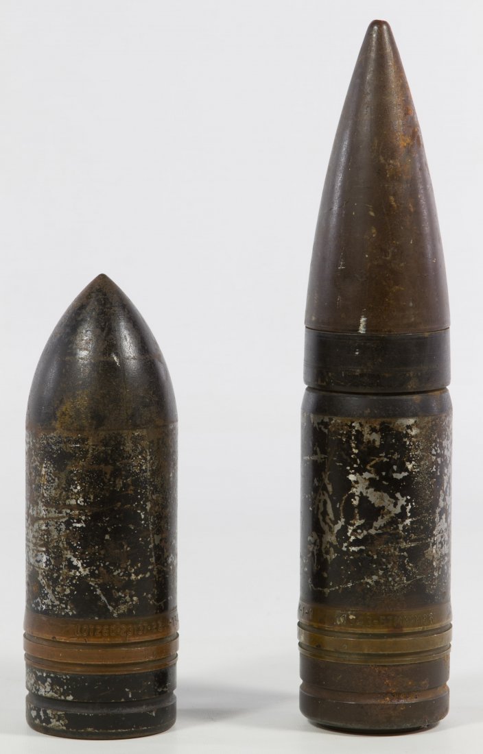 World War II Artillery Shells: World War II Artillery Shells Two items including a projectile anti-tank 57mm shot marked '1943, LOT GJM-1-1' and a smaller 57mm shot marked 'LOT 260-23137-22, 1942-GJM' Length: 10.50 inches (longest)