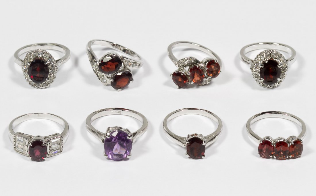 Sterling Silver, Garnet and Amethyst Ring Assortment: Sterling Silver, Garnet and Amethyst Ring Assortment Eight rings all set with gemstones including garnets and amethyst, some with clear crystal adornments Size: 5 to 6.5 Weight: 16.91 dwts. (total wei