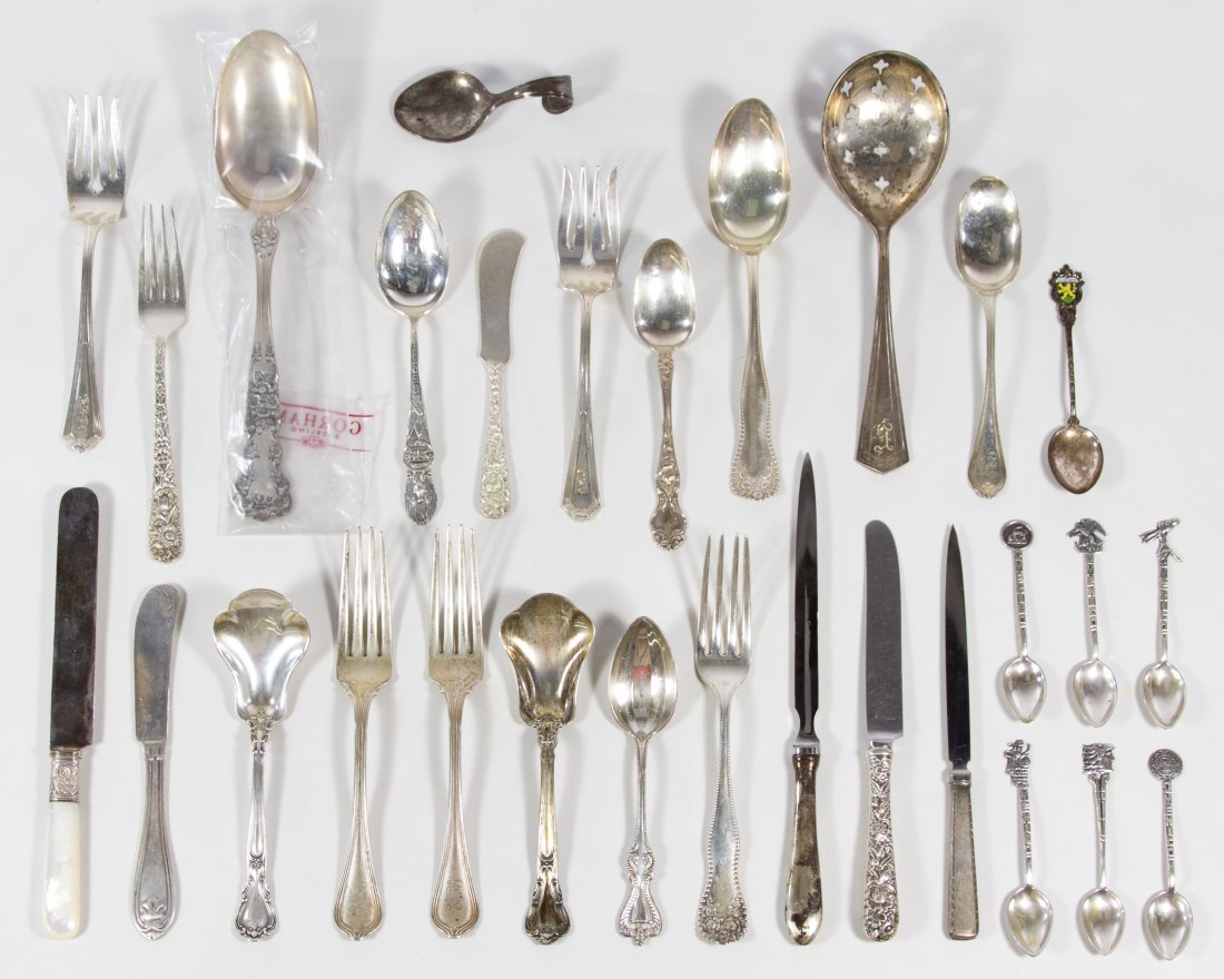 Sterling Silver Flatware Assortment: Sterling Silver Flatware Assortment Nineteen utensils; having some produced by Gorham and Kirk; together with seven sterling silver souvenir spoons and one coin silver butter knife Length: 8.50 inches