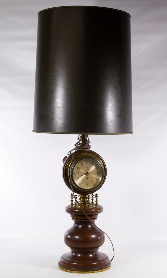 Wood and Metal Table Lamp: Wood and Metal Table Lamp Fitted with a Salem 8-day 7 jewel clock, a Salem Barometer and Stiffel shade Height: 45.00 inches (including shade) Category: Decorative Arts > Lamps Shipping Status: Due to 