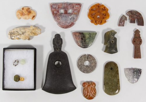 Asian Stone Amulet and Pendant Assortment: Asian Stone Amulet and Pendant Assortment Seventeen items including four beads in a shadow box, carved and etched stone animal pendants and a large axe shaped item with a carved figure Length: 6.50 in