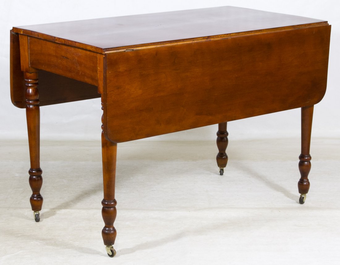 Cherry Drop Leaf Table: Cherry Drop Leaf Table Rectangular table having turned legs and drop side leaves Height: 30.50 inches, Length: 44.00 inches, Width: 24.00 inches (width with 12 inch leaves dropped) Category: Furniture