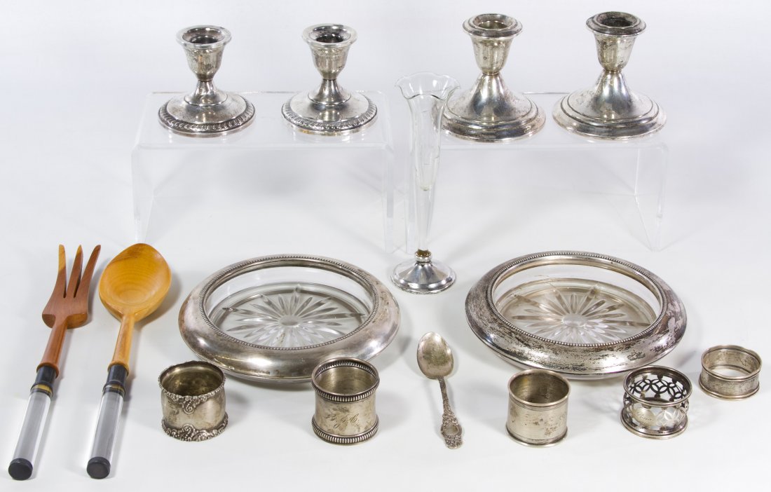 Sterling Silver Object Assortment: Sterling Silver Object Assortment Including five napkin rings, four weighted candlesticks, two sterling rimmed ash trays, two serving utensils with sterling bands, a sterling spoon and a weighted vase