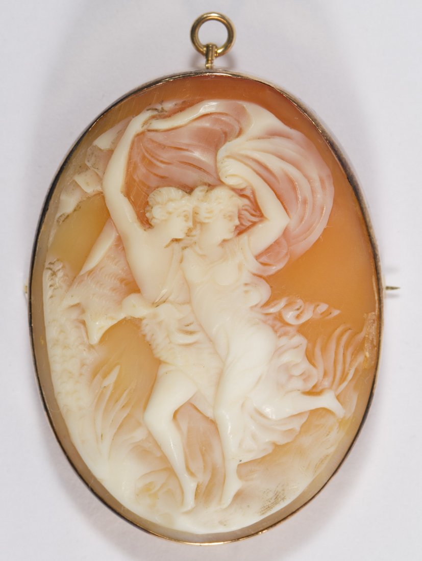 14k Gold Framed Cameo Pin / Pendant: 14k Gold Framed Cameo Pin / Pendant Carved shell depicting a frolicking couple Length: 2.00 inches Weight: 10.29 dwts. (total weight) Category: Jewelry and Timepieces > 14k Gold Shipping Status: Leona