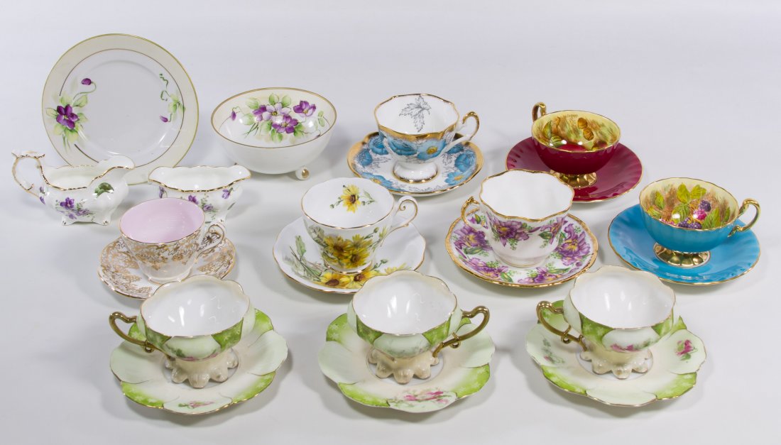 Aynsley Orchard Fruits Cup and Saucer Sets: Aynsley Orchard Fruits Cup and Saucer Sets Two sets having fruit motifs; together with seven porcelain cup and saucer sets, a porcelain cream and sugar, a Nippon porcelain bowl and saucer and twenty-s