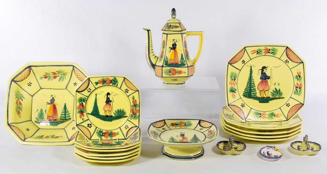 Quimper 'Soleil - Yellow' Pottery Assortment: Quimper 'Soleil - Yellow' Pottery Assortment Seventeen items including six salad plates, five dinner plates, three toothpick holders, a serving bowl, a teapot and a cake platter; all have stamped mark