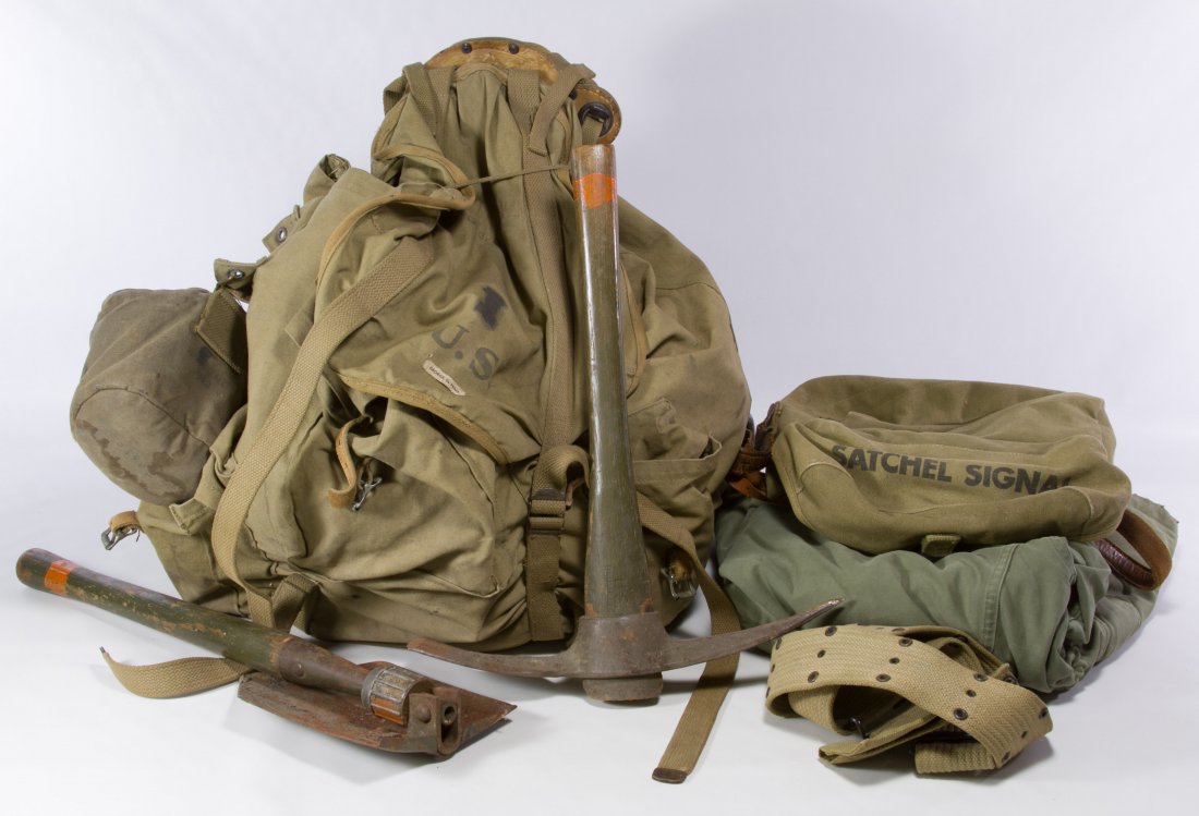 World War II U.S. Army Tent Pack and First Aid Kit: World War II U.S. Army Tent Pack and First Aid Kit Assortment Including a canvas back pack with tent, water bottle and first aid kit, a pick mattock, a folding shovel, a second first aid kit, a Satche