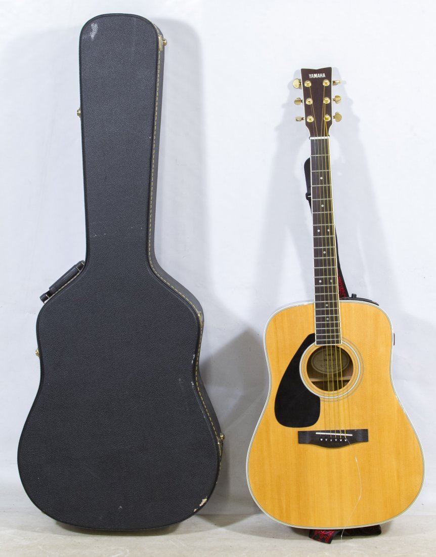 Yamaha DW-4SLE Left Handed Acoustic Guitar: Yamaha DW-4SLE Left Handed Acoustic Guitar Serial #70825293; together with a black strap and black guitar case Length: 42.00 inches (guitar) Category: Musical Instruments > Guitars Shipping Status: Du
