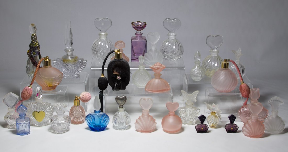 Pressed Glass Perfume Bottle Assortment: Pressed Glass Perfume Bottle Assortment Including clear and satin glass bottles with one marked Lalique and most either unmarked or marked 'Made in Taiwan' Height: 7.25 inches (tallest) Category: Glas