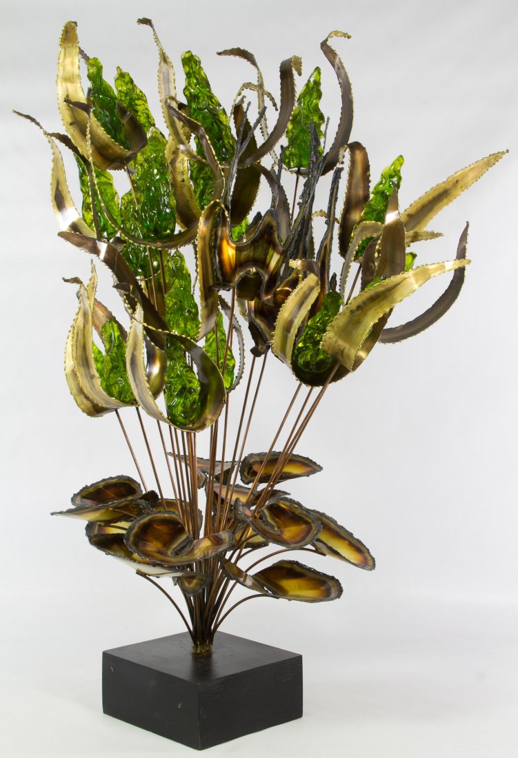 Curtis Jere Style Floral Sculpture: Curtis Jere Style Floral Sculpture 20th century, unmarked, mounted on a wood base; two detached parts Height: 31.00 inches, Width: 22.00 inches Category: Decorative Arts > Objects Shipping Status: Due