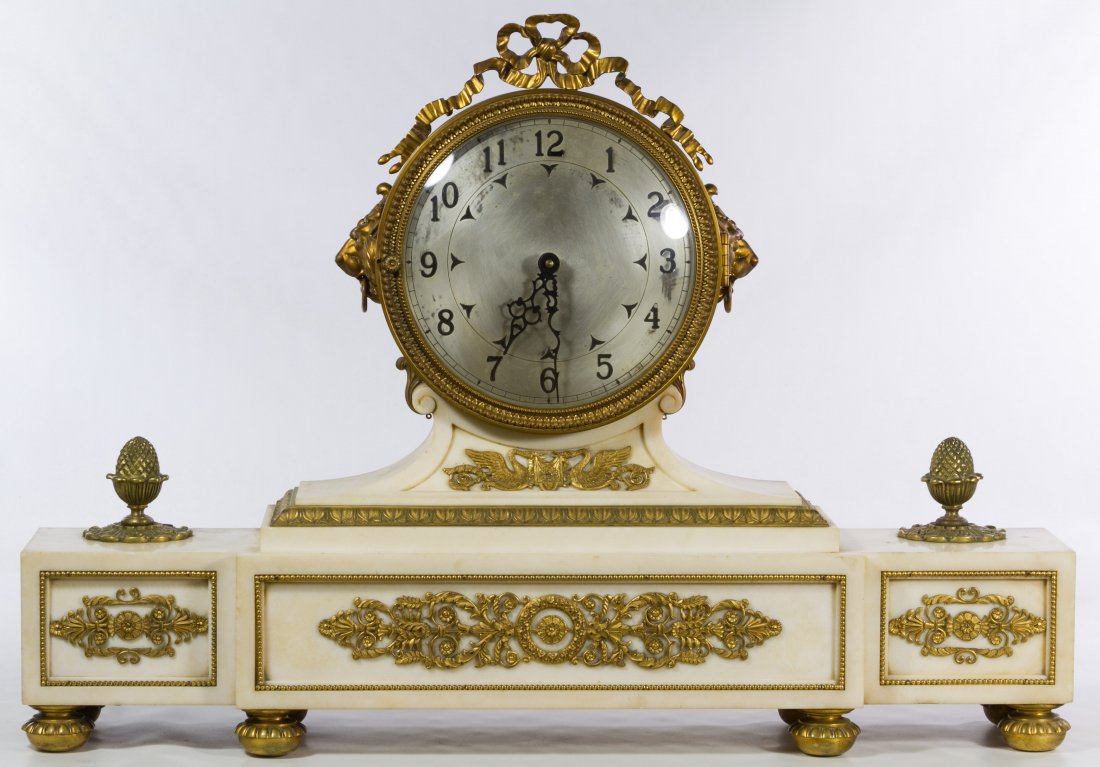 Alabaster Mantel Clock: Alabaster Mantel Clock 20th Century, having a lion head motif, purchased from the Palmer House hotel in the 1970s Height: 20.50 inches, Width: 29.00 inches, Depth: 5.00 inches Category: Decorative Art