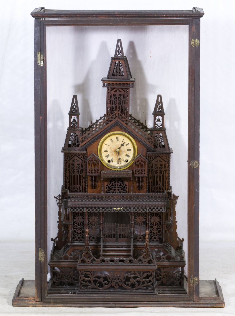 Tramp Art Clock in Case: Tramp Art Clock in Case Done in the style of Bily and inside a case Height: 35.00 inches, Width: 19.00 inches Category: Decorative Arts > Clocks Shipping Status: Due to size, weight, value or shipping