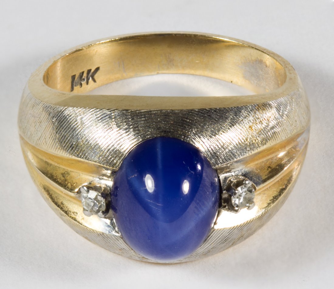 14k Gold and Lindy Star Sapphire Ring: 14k Gold and Lindy Star Sapphire Ring Having an oval cut cabochon blue star sapphire flanked by two diamond chips Size: 7.5 Weight: 5.72 dwts. (total weight) Category: Jewelry and Timepieces > 14k Gol