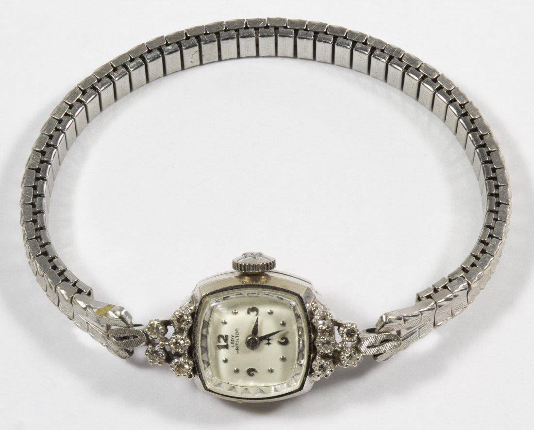 Lady Hamilton 14k White Gold and Diamond Cased 761: Lady Hamilton 14k White Gold and Diamond Cased 761 Wrist Watch Square faced watch having ten round cut diamond chips, twenty-two jewel works Length: 6.50 inches (adjustable bands) Weight: 8.42 dwts. (