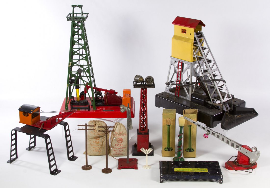 Lionel Toy Train Accessory Assortment: Lionel Toy Train Accessory Assortment Including a plastic and metal coal elevator, a #455 oil derrick and pumper with box, #30 water tower in box, #313 bascule bridge, signal lights, crossing gate and