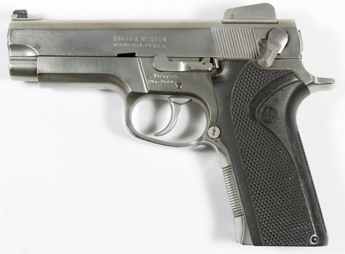 Smith & Wesson Model 4006 .40 Cal. Semi-Automatic: Smith & Wesson Model 4006 .40 Cal. Semi-Automatic Pistol (Serial #TVC9739) Stainless steel, includes three 11-round magazines, hard case and manual Length: 4.00 inches (barrel length) Category: Sporti