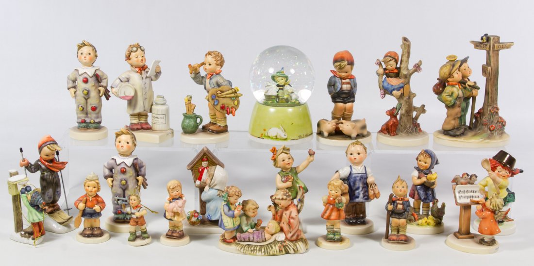 Hummel / Goebel Figurine Assortment: Hummel / Goebel Figurine Assortment Including twenty one figurines and a musical snow globe with TMK #5 through TMK #7 Height: 6.75 inches (tallest) Category: Figurines > Hummel / Goebel Shipping Stat