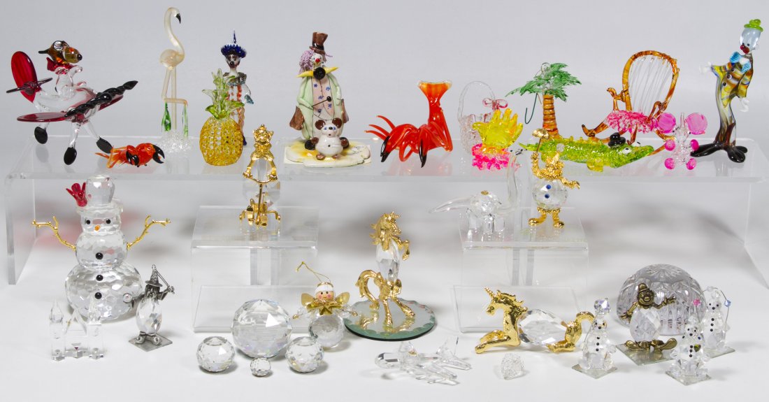 Crystal and Spun Glass Figurine Assortment: Crystal and Spun Glass Figurine Assortment Including unmarked crystal spheres, snowmen, clowns and unicorns and spun glass clown, fruit and Snoopy figurines; and a Zampiva glass clown Height: 5.00 inc