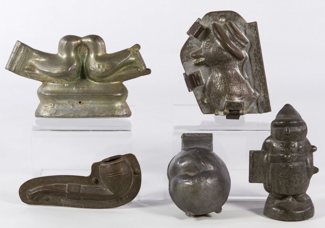 Candy and Ice Cream Mold Assortment: Candy and Ice Cream Mold Assortment Five metal items including a tin pipe mold #10196, an 'E & Co. 234' hinged pewter peach mold, a '405' pewter hinged officer mold, an 'E & Co. 665' cast metal love b
