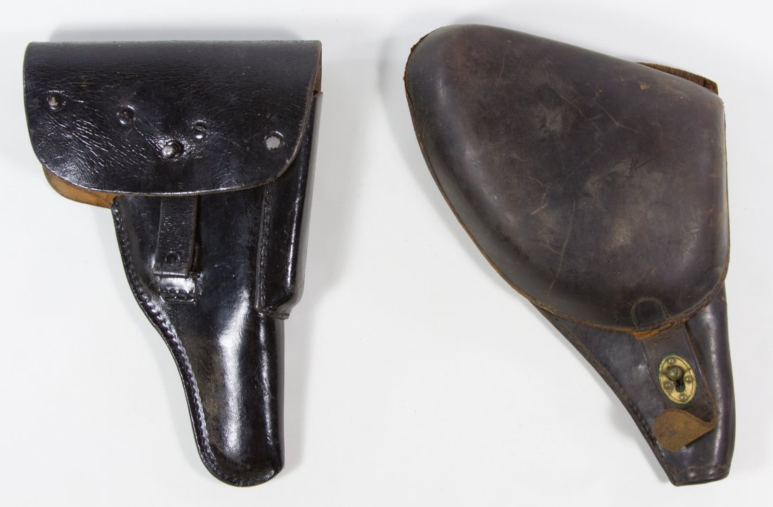 World War II Pistol Holsters: World War II Pistol Holsters Two leather holsters; one possibly German Length: 9.00 inches Category: Military & Weapons > World War II Shipping Status: Leonard Auction, Inc. will directly ship via USP