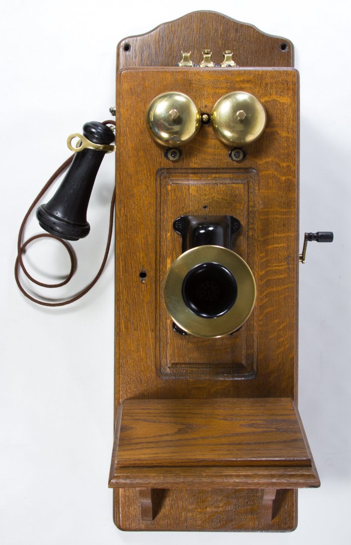 Dean Electric Wall Mounted Telephone: Dean Electric Wall Mounted Telephone Oak case, having interior parts, stamped maker's mark Height: 26.00 inches, Width: 9.00 inches, Depth: 11.50 inches Category: Cameras and Electronics > Telephones 