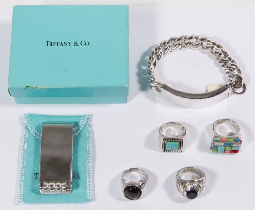 Sterling Silver Men's Jewelry Assortment: Sterling Silver Men's Jewelry Assortment Including a Tiffany & Co money clip by Paloma Picasso, four rings with various gemstones some of which are signed and a chain ID bracelet Length: 2.25 inches (