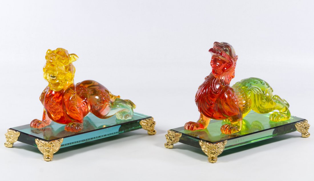 Oriental Lucite Foo Dogs: Oriental Lucite Foo Dogs 20th Century, on glass platform having brass feet Height: 7.25 inches, Width: 11.00 inches, Depth: 5.00 inches Category: Decorative Arts > Asian Shipping Status: Due to size, 