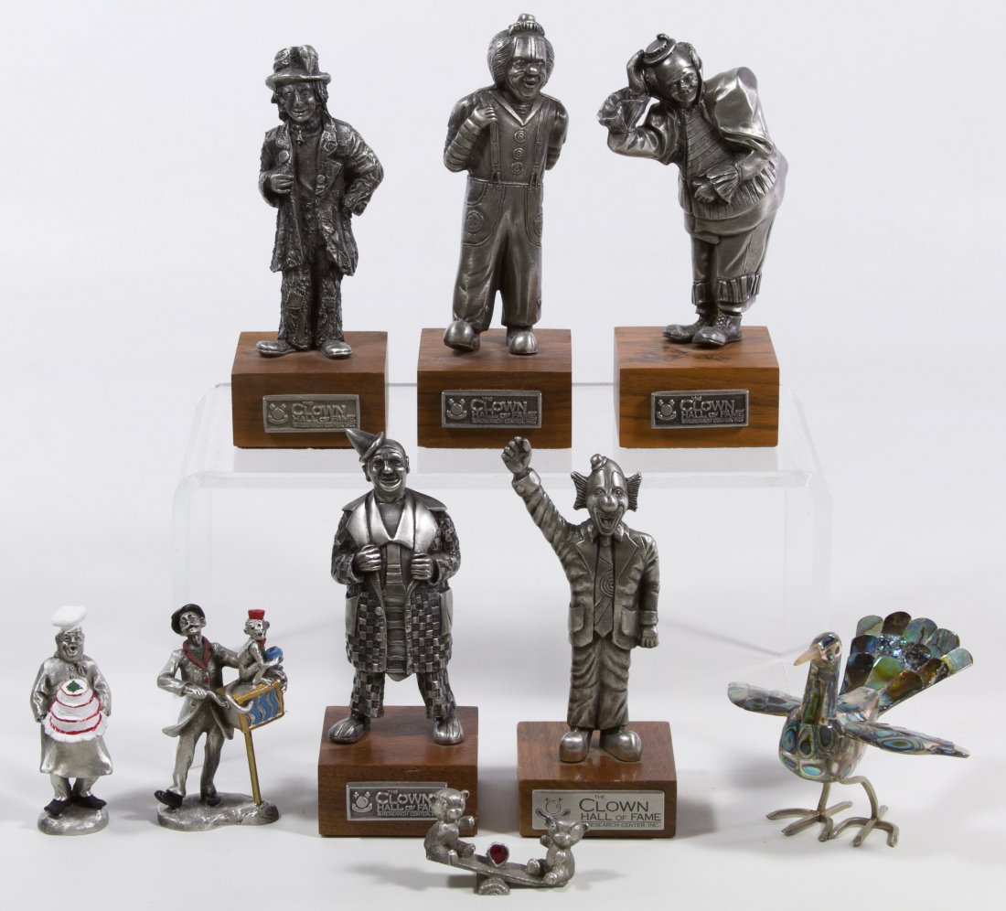Clown Hall of Fame Figurine Assortment: Clown Hall of Fame Figurine Assortment Including five metal 'Clown Hall of Fame' figurines on wooden stands with two having signatures: 'Loa Jacobs' and 'Timothy Adler Doran;' together with three smal