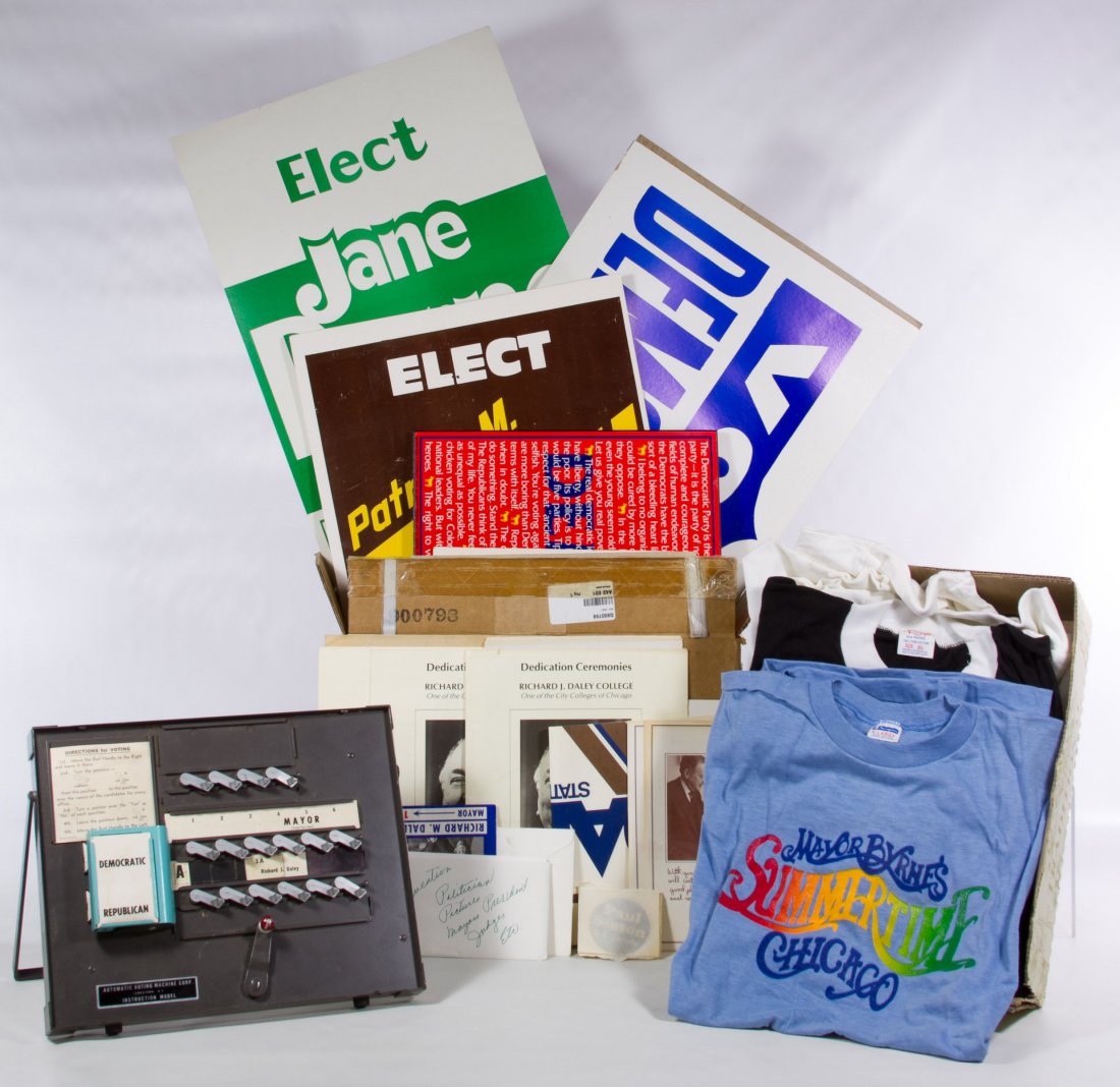 Chicago Political Collectibles Assortment: Chicago Political Collectibles Assortment Including an automatic voting machine instructional model, pinback buttons, T-shirts, posters and photographs for Richard J. Daley, Jane Byrne and Michael Bil