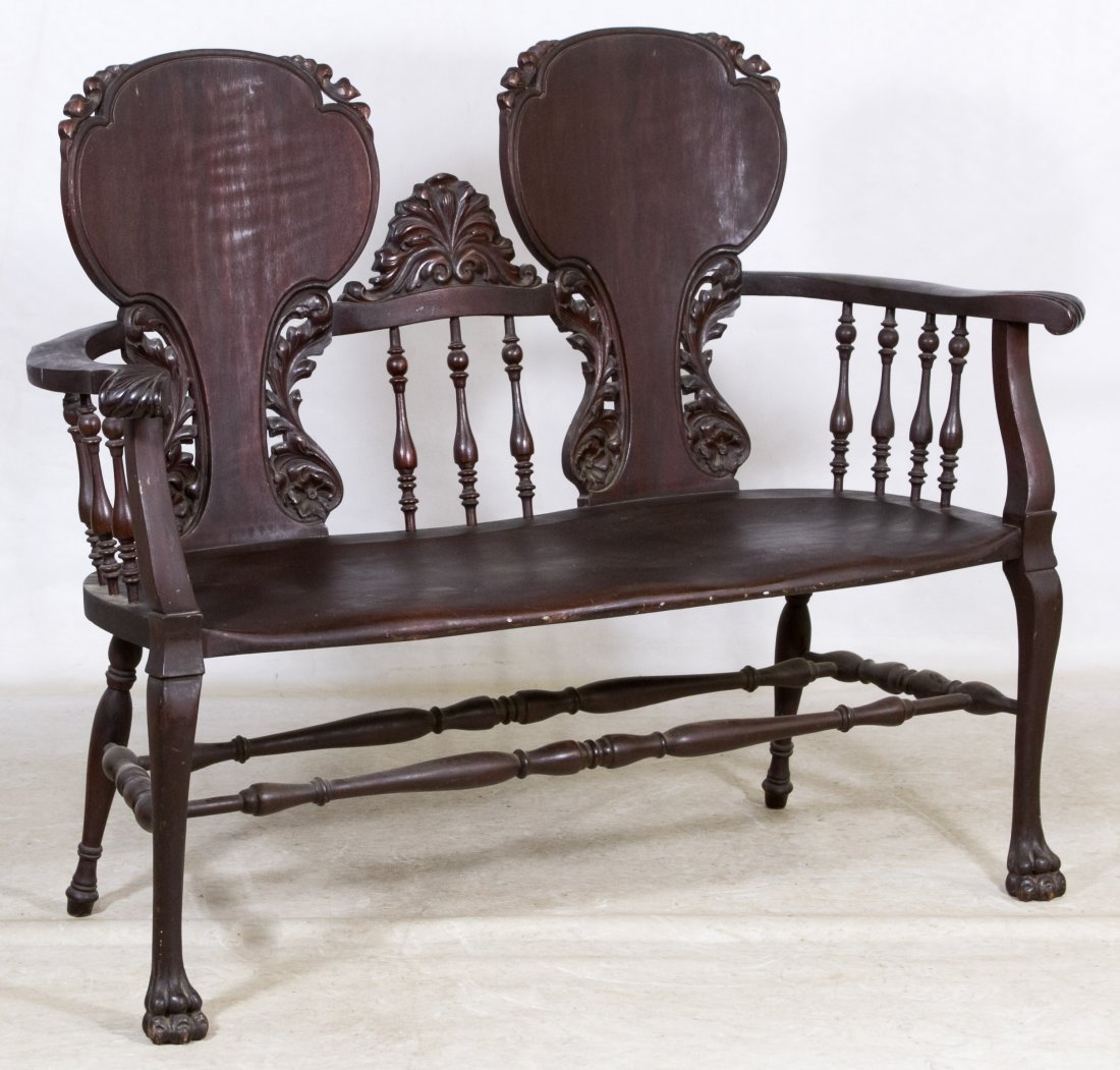 Gothic Walnut Carved Bench by Stickley & Brandt: Gothic Walnut Carved Bench by Stickley & Brandt Two seat bench having carved ball and claw feet and acanthus leaf back splats with spindles Height: 38.00 inches, Width: 48.00 inches, Depth: 21.00 inch