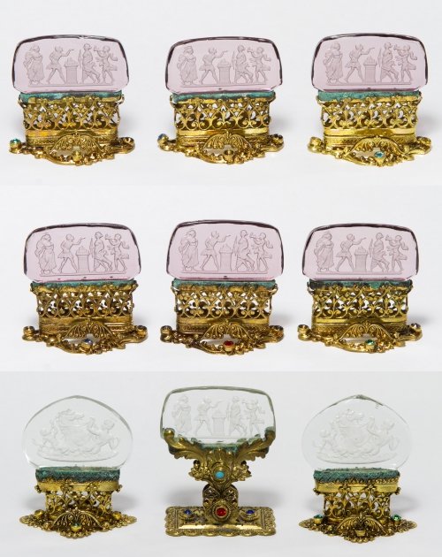 Intaglio Glass Placecard Holders: Intaglio Glass Placecard Holders Nine holders, all having brass and jeweled bases; 'Made in Czechoslovakia' stamped to the inner metal frame Height: 2.25 inches (tallest) Category: Silver > Other Ship