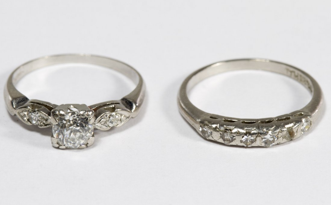 Platinum and Diamond Ring Set: Platinum and Diamond Ring Set Including an engagement ring having a round cut diamond weighing approximately 0.50CT flanked by two round cut diamonds and a wedding band having six round cut diamonds S