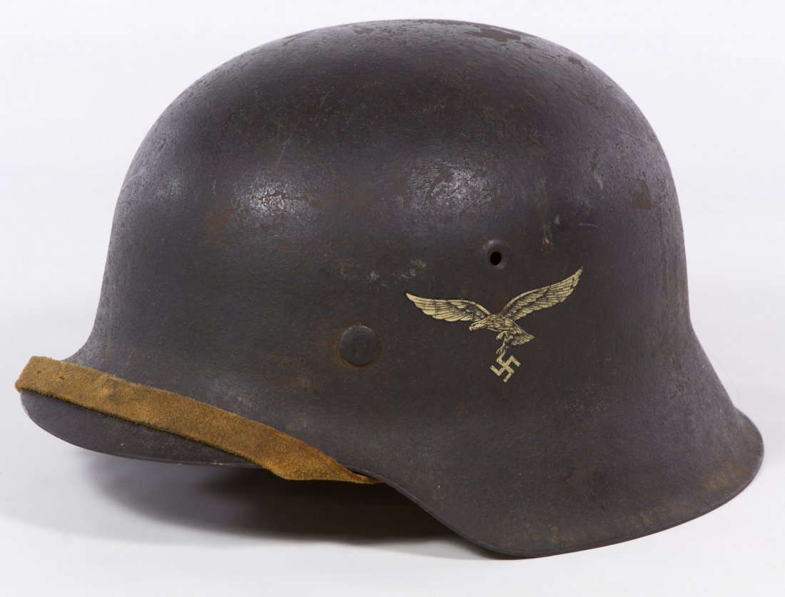 World War II German Luftwaffe M42 Combat Helmet: World War II German Luftwaffe M42 Combat Helmet Single decal, shell ET62, liner size 55, lot 2204, with original liner and chin strap Length: 11.00 inches, Width: 9.50 inches Category: Military & Weap