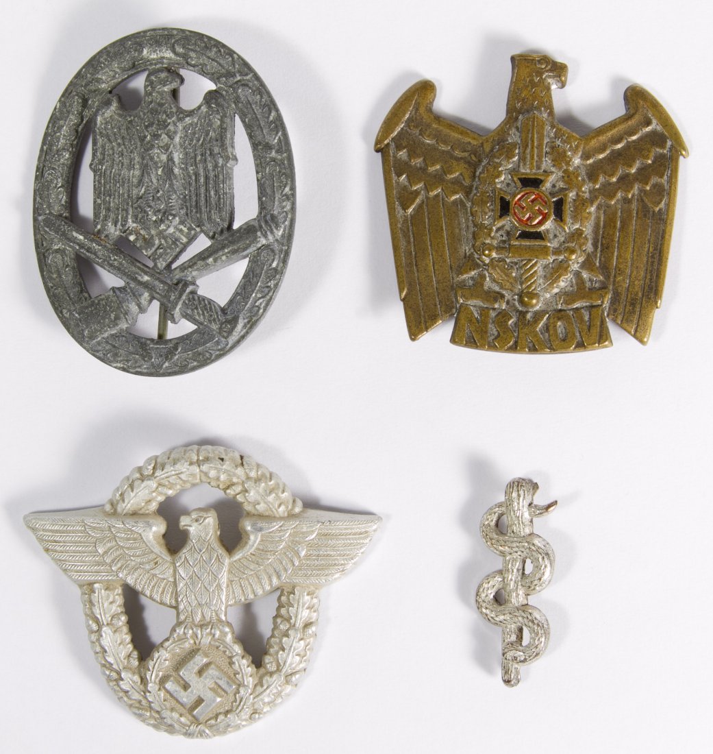 World War II German Medal Assortment: World War II German Medal Assortment Four pieces including a Medical Doctor device for shoulder boards, general assault badge, police hat visor and NSKOV eagle / veteran organization badge Height: 2.2
