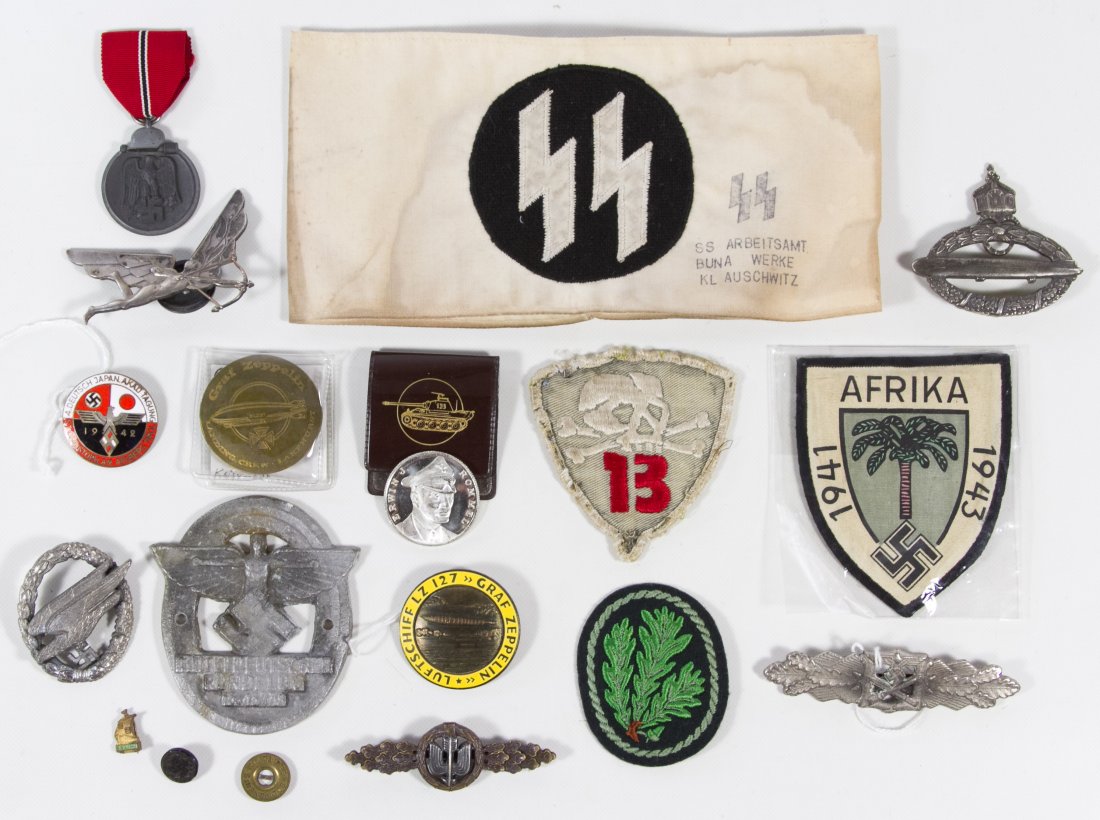 World War II German Reproduction Nazi Decoration: World War II German Reproduction Nazi Decoration Assortment Including patches, an SS arm band, medals and pins Category: Military & Weapons > Medals Shipping Status: Leonard Auction, Inc. will directl