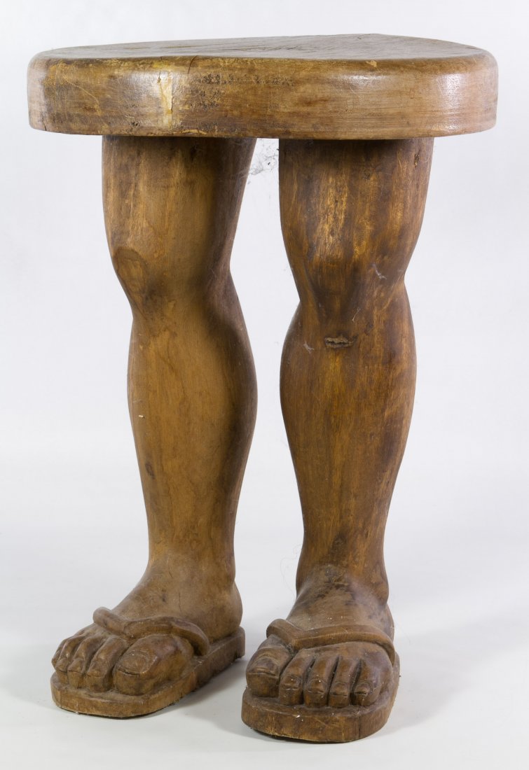 Carved Wood Folk Art Table: Carved Wood Folk Art Table Having two human form legs with sandals on feet secured into a round separate table top; softwood Height: 18.00 inches, Diameter: 13.00 inches Category: Furniture > Contempo