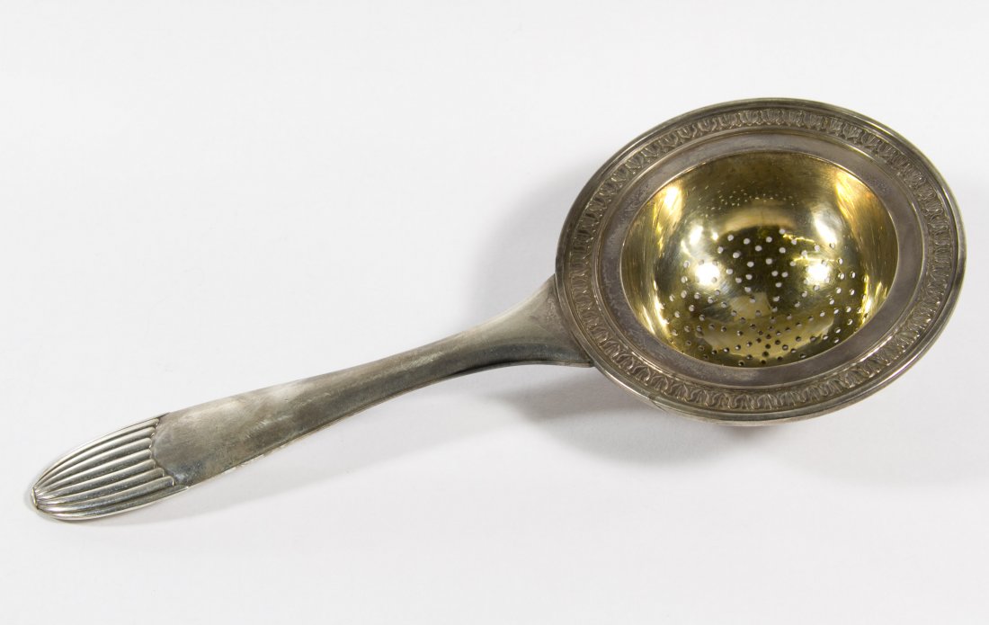 Russian Sterling Silver (.875) Tea Strainer: Russian Sterling Silver (.875) Tea Strainer c.1910, Moscow, maker's mark illegible Length: 6.50 inches Weight: 3.44 ozt. Category: Silver > European Silver Shipping Status: Leonard Auction, Inc. will